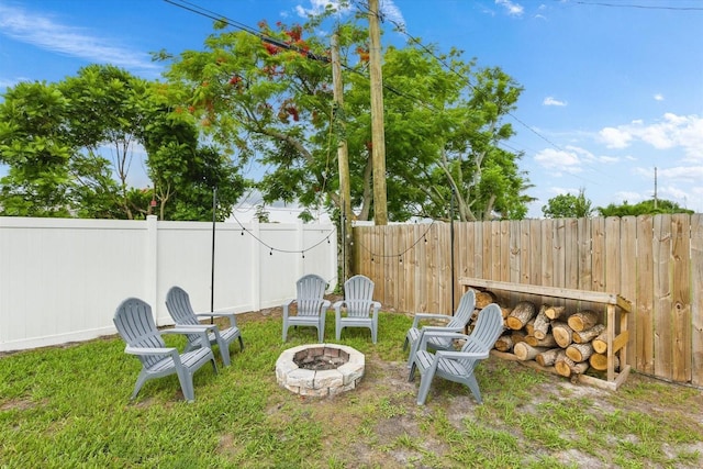 652 SW Mccoy Ave, Port St Lucie, FL 34953 - fenced backyard with a fire pit