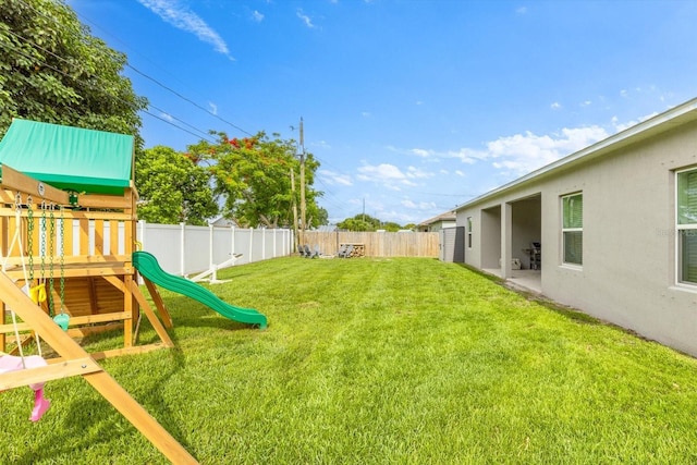 652 SW Mccoy Ave, Port St Lucie, FL 34953 - view of yard featuring a playground