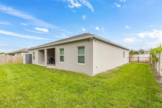 652 SW Mccoy Ave, Port St Lucie, FL 34953 - rear view of property featuring stucco siding and a patio