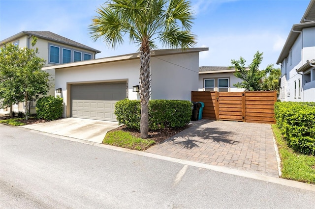 13334 Beebe Aly, Orlando, FL 32827 - view of front of house with stucco siding, driveway, and an attached garage