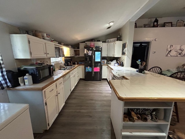 2847 Crk 756, Webster, FL 33597 - kitchen with black appliances, open shelves, a peninsula, white cabinets, and lofted ceiling