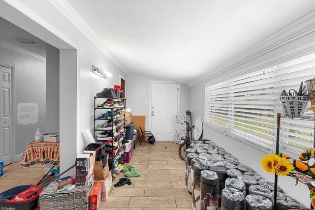 1877 Attucks Ave, Orlando, FL 32811 - playroom with crown molding and vaulted ceiling