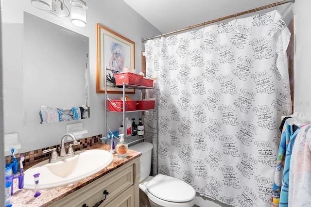 1877 Attucks Ave, Orlando, FL 32811 - bathroom featuring decorative backsplash, vanity, toilet, and curtained shower