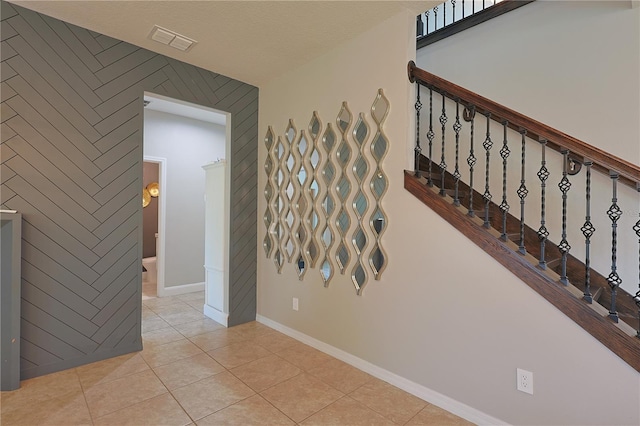9257 Outlook Rock Trl, Windermere, FL 34786 - stairway with tile patterned flooring and baseboards