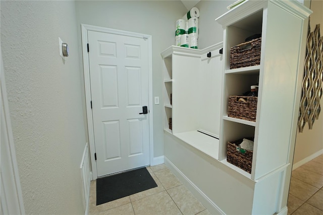 9257 Outlook Rock Trl, Windermere, FL 34786 - mudroom with tile patterned flooring and baseboards