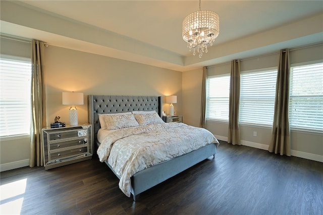 9257 Outlook Rock Trl, Windermere, FL 34786 - bedroom with baseboards, dark wood finished floors, a chandelier, and multiple windows