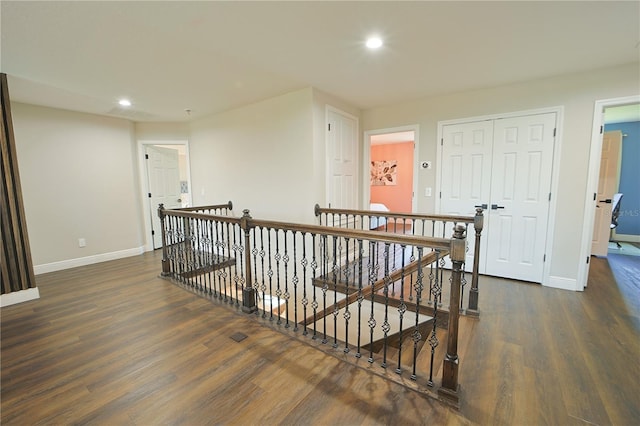 9257 Outlook Rock Trl, Windermere, FL 34786 - hallway with an upstairs landing, baseboards, recessed lighting, and dark wood-style flooring