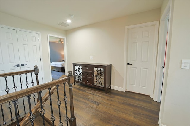 9257 Outlook Rock Trl, Windermere, FL 34786 - hallway featuring dark wood-type flooring, baseboards, an upstairs landing, and recessed lighting