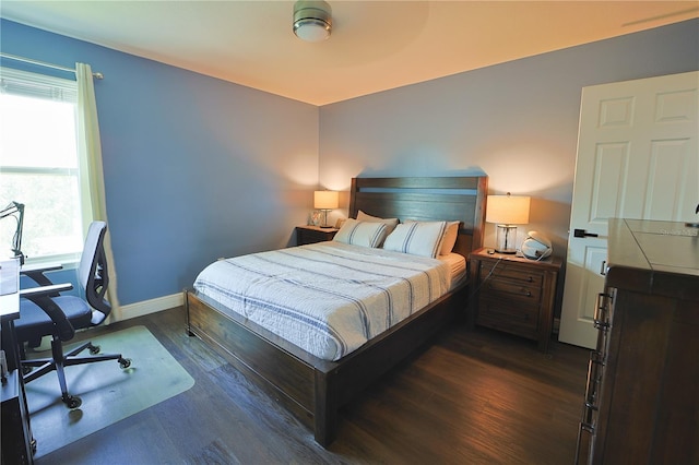 9257 Outlook Rock Trl, Windermere, FL 34786 - bedroom with an office area, dark wood finished floors, and baseboards