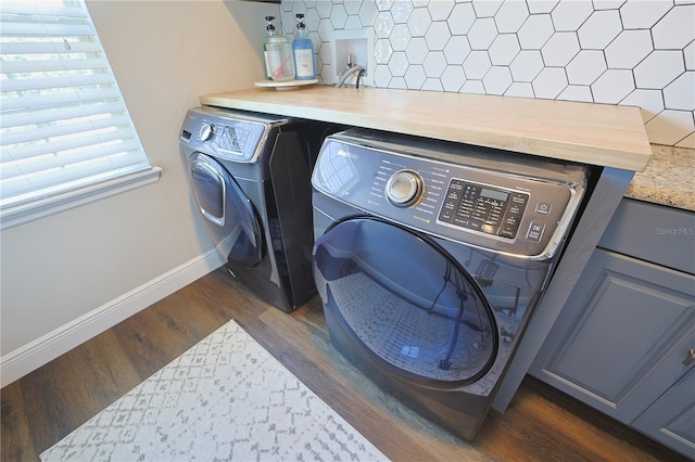 9257 Outlook Rock Trl, Windermere, FL 34786 - laundry area with independent washer and dryer, dark wood-type flooring, and baseboards