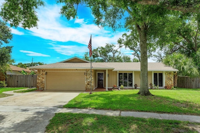 4739 Indian Gap Dr, Orlando, FL 32812 - single story home with an attached garage, concrete driveway, and stone siding