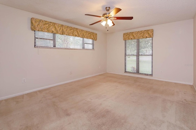 4739 Indian Gap Dr, Orlando, FL 32812 - spare room with a ceiling fan, baseboards, and light carpet