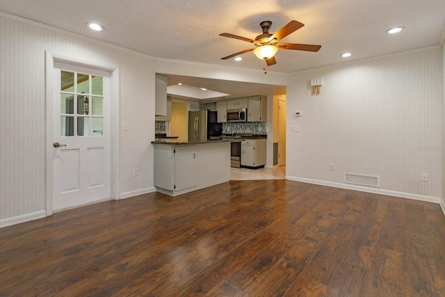 4739 Indian Gap Dr, Orlando, FL 32812 - unfurnished living room featuring crown molding, wood finished floors, baseboards, a ceiling fan, and a textured ceiling