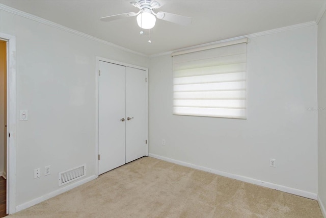 4739 Indian Gap Dr, Orlando, FL 32812 - unfurnished bedroom featuring carpet flooring, baseboards, crown molding, a closet, and a ceiling fan