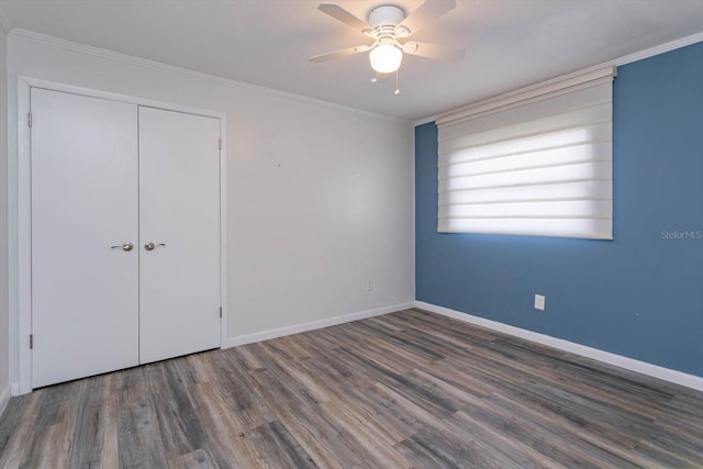4739 Indian Gap Dr, Orlando, FL 32812 - unfurnished bedroom with wood finished floors, baseboards, ornamental molding, a closet, and a ceiling fan