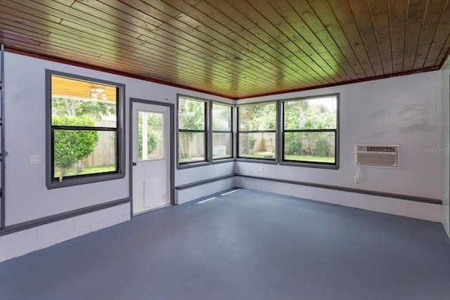 4739 Indian Gap Dr, Orlando, FL 32812 - unfurnished room with healthy amount of natural light, wooden ceiling, concrete flooring, and a wall mounted air conditioner