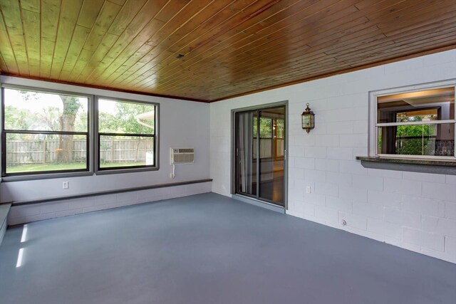 4739 Indian Gap Dr, Orlando, FL 32812 - unfurnished sunroom featuring healthy amount of natural light, a baseboard radiator, and a wall mounted AC