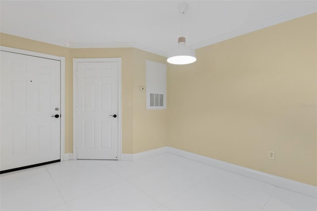 5467 Vineland Rd Unit 6110, Orlando, FL 32811 - tiled spare room with baseboards and crown molding