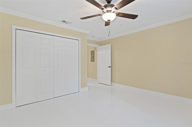 5467 Vineland Rd Unit 6110, Orlando, FL 32811 - unfurnished bedroom featuring electric panel, crown molding, a closet, ceiling fan, and light tile patterned floors