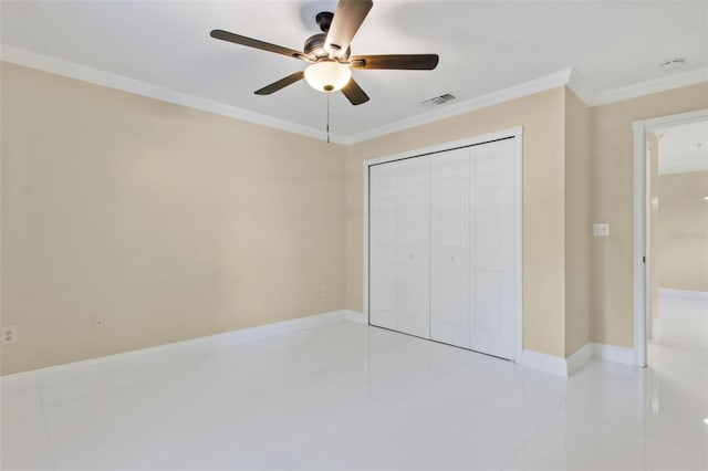 5467 Vineland Rd Unit 6110, Orlando, FL 32811 - unfurnished bedroom featuring crown molding, a closet, light tile patterned floors, and a ceiling fan