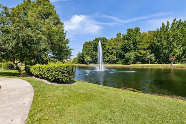5467 Vineland Rd Unit 6110, Orlando, FL 32811 - view of community with a water view and a yard