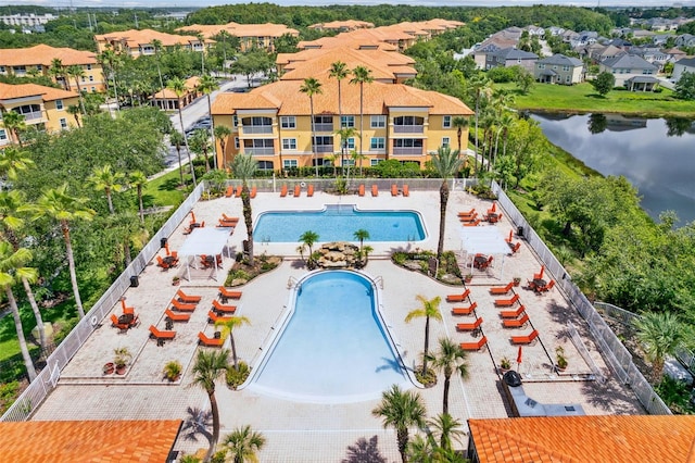 5467 Vineland Rd Unit 6110, Orlando, FL 32811 - drone / aerial view of a pool area and a nearby body of water