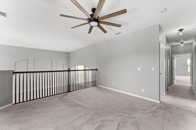 2753 Glenridge Cir, Merritt Island, FL 32953 - carpeted empty room with ceiling fan, baseboards, and attic access