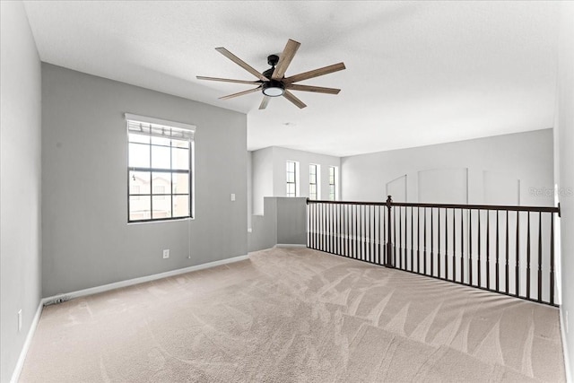 2753 Glenridge Cir, Merritt Island, FL 32953 - unfurnished room with a ceiling fan, carpet flooring, and baseboards