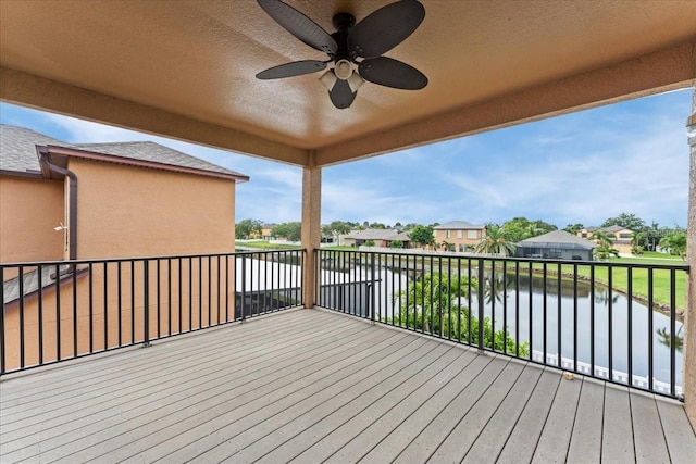 2753 Glenridge Cir, Merritt Island, FL 32953 - wooden deck featuring a water view, a ceiling fan, and a residential view