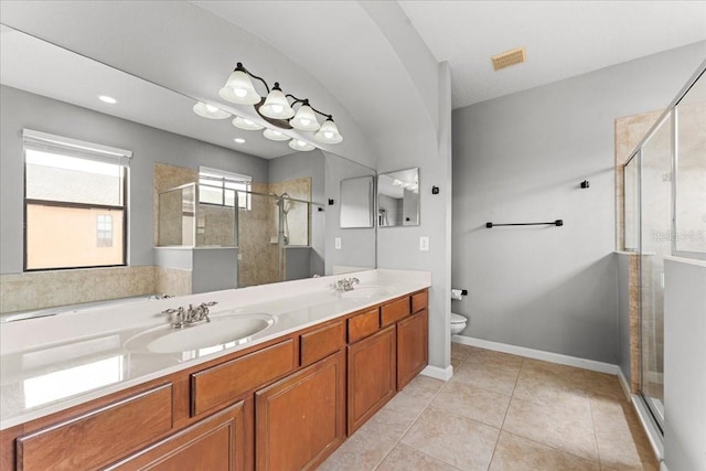 2753 Glenridge Cir, Merritt Island, FL 32953 - bathroom with a shower stall, toilet, double vanity, tile patterned flooring, and baseboards