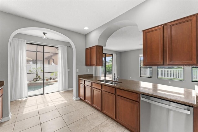 2753 Glenridge Cir, Merritt Island, FL 32953 - kitchen featuring stainless steel dishwasher, a sink, brown cabinetry, and recessed lighting