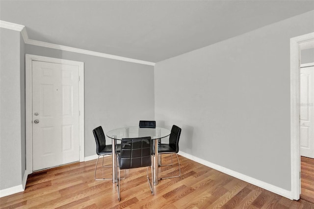 1940 S Conway Rd Unit 8, Orlando, FL 32812 - dining area featuring ornamental molding and light wood finished floors