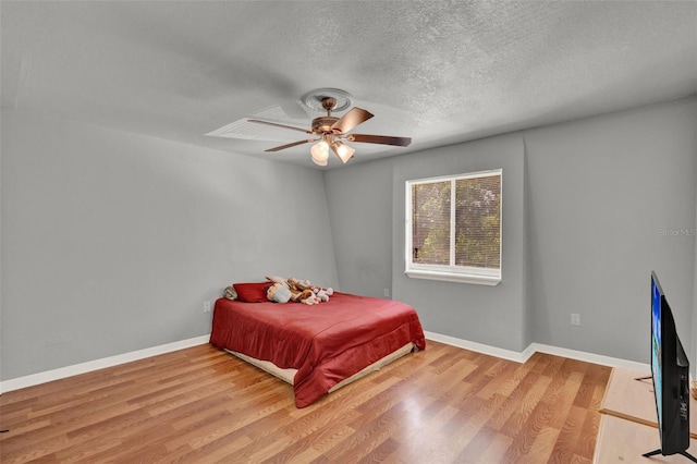 1940 S Conway Rd Unit 8, Orlando, FL 32812 - bedroom featuring light wood finished floors, a textured ceiling, and ceiling fan