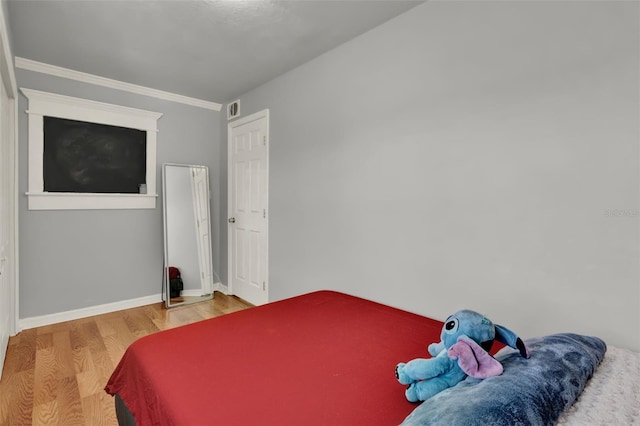 1940 S Conway Rd Unit 8, Orlando, FL 32812 - bedroom featuring wood finished floors and crown molding