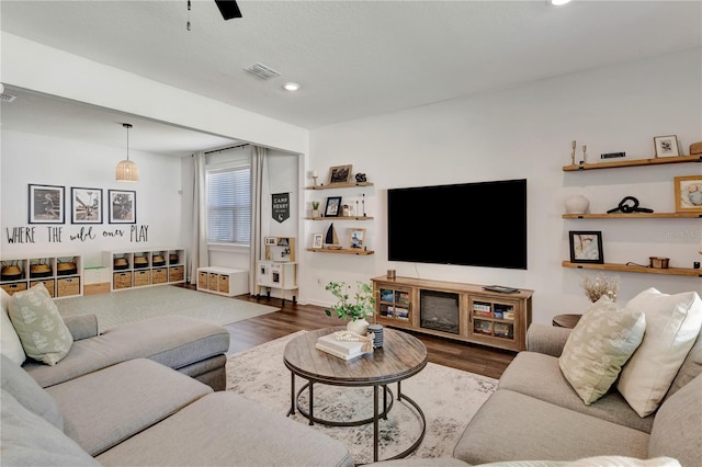 2335 Green Symphony Pl, Oviedo, FL 32765 - living room featuring dark wood-style flooring and recessed lighting