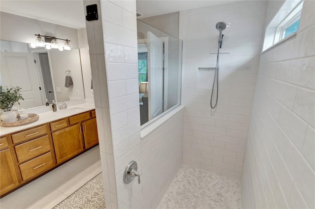 2335 Green Symphony Pl, Oviedo, FL 32765 - bathroom featuring a walk in shower, vanity, and tile patterned floors