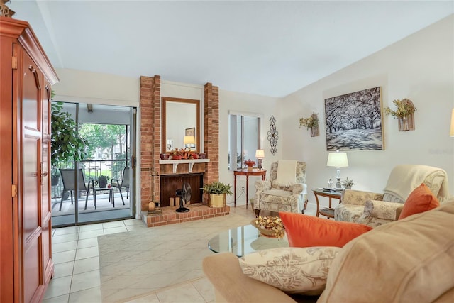 14 Escondido Ct Unit 134, Altamonte Springs, FL 32701 - living room featuring vaulted ceiling, light tile patterned floors, and a brick fireplace