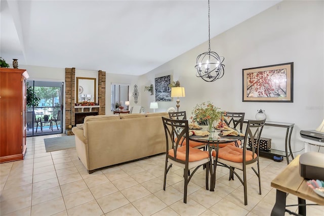 14 Escondido Ct Unit 134, Altamonte Springs, FL 32701 - dining area with lofted ceiling, a chandelier, light tile patterned floors, and a fireplace