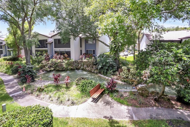 14 Escondido Ct Unit 134, Altamonte Springs, FL 32701 - surrounding community with a garden pond