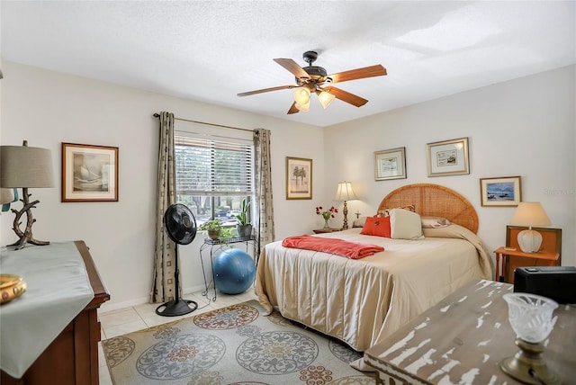 14 Escondido Ct Unit 134, Altamonte Springs, FL 32701 - bedroom with light tile patterned floors, a ceiling fan, and baseboards