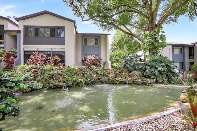 14 Escondido Ct Unit 134, Altamonte Springs, FL 32701 - exterior space featuring a garden pond
