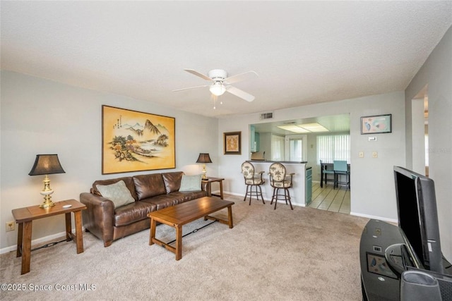 1515 Huntington Ln Unit 426, Rockledge, FL 32955 - living area featuring ceiling fan, light carpet, and baseboards