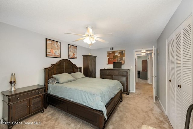 1515 Huntington Ln Unit 426, Rockledge, FL 32955 - bedroom featuring a closet, light carpet, ceiling fan, and baseboards