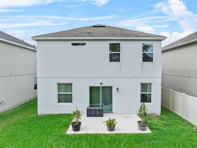 2620 Waterline St, Kissimmee, FL 34743 - back of house with a patio, a shingled roof, and stucco siding