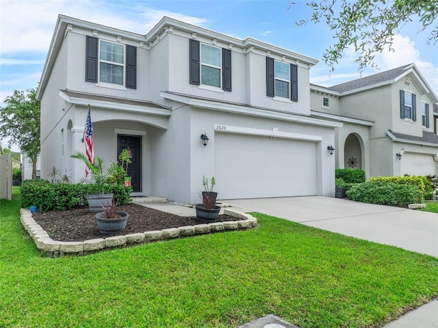 2620 Waterline St, Kissimmee, FL 34743 - view of front of home featuring stucco siding, a garage, a front yard, and driveway