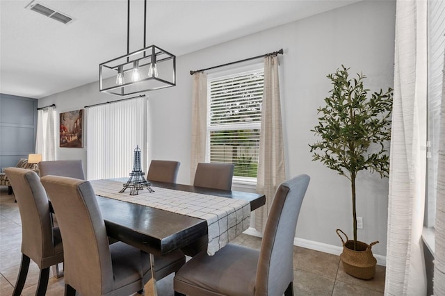 2620 Waterline St, Kissimmee, FL 34743 - tiled dining area with baseboards