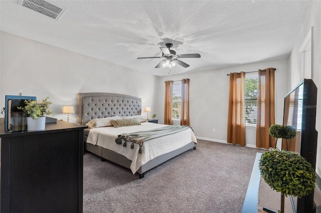 2620 Waterline St, Kissimmee, FL 34743 - carpeted bedroom with ceiling fan, baseboards, and a textured ceiling