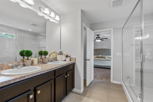 2620 Waterline St, Kissimmee, FL 34743 - full bath with connected bathroom, double vanity, a shower stall, and baseboards