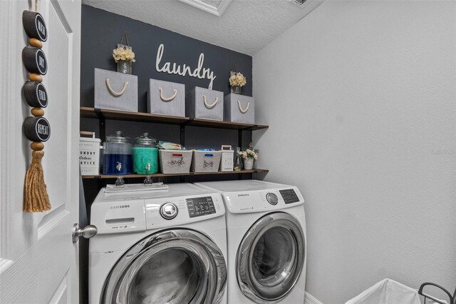2620 Waterline St, Kissimmee, FL 34743 - laundry area featuring washing machine and dryer and a textured ceiling