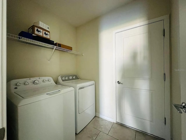 2807 Alder Berry Blvd, Ocoee, FL 34761 - laundry area with independent washer and dryer and light tile patterned flooring
